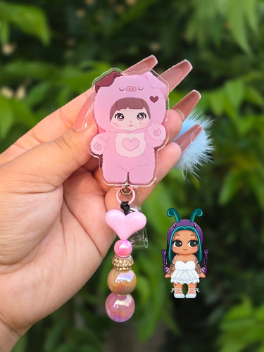 Nommi trinket badge reel